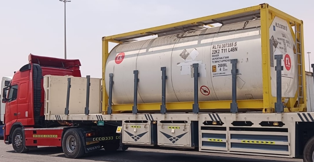 ISO tank containers loaded on flatbed trucks