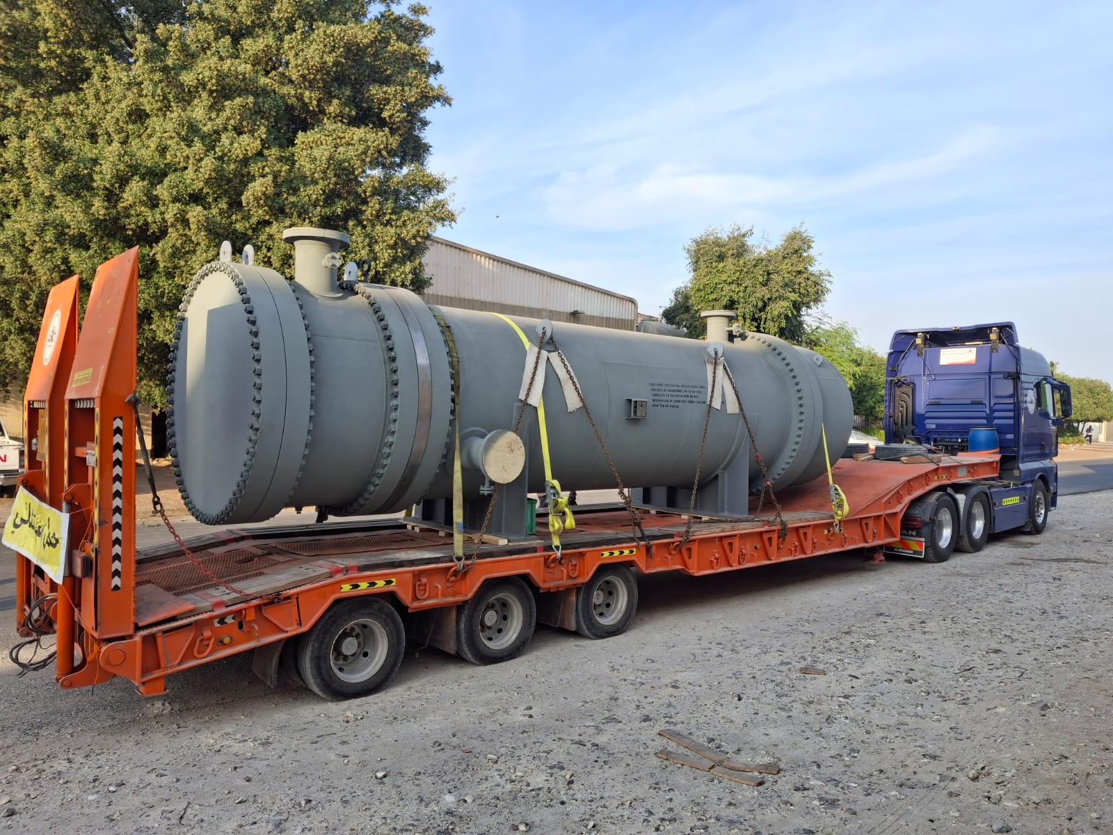 Pressure vessel on a low-bed trailer with a truck cab attached